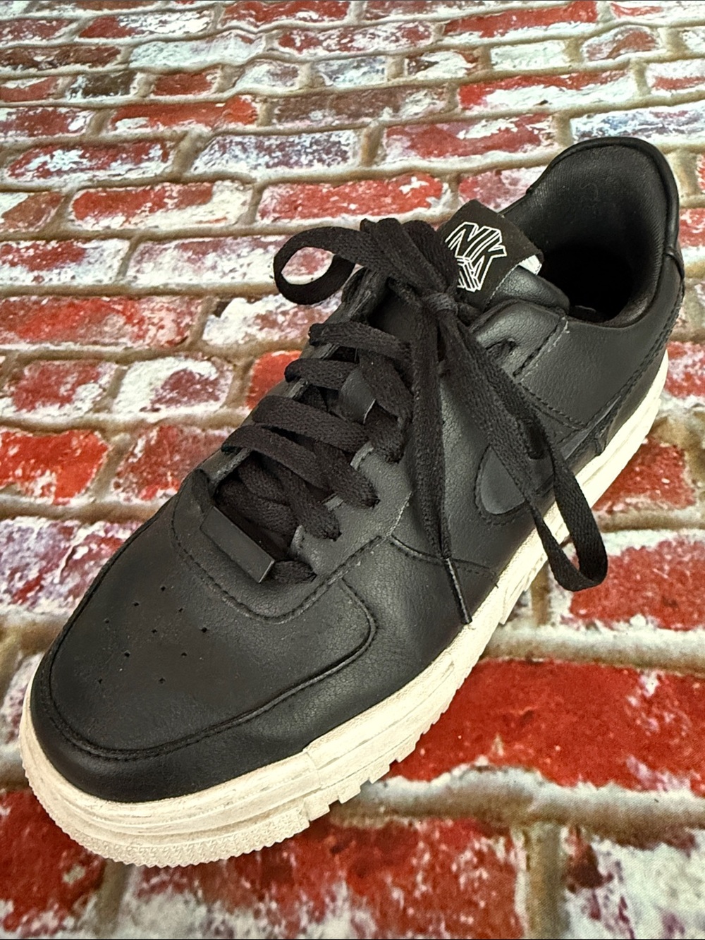 Nike Women's Black Leather Low-Top Sneaker with Off-White Sole